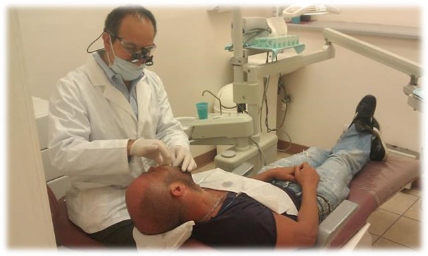 Best_Dentist_Los_Angeles_Dr_Labib_Treating_Patient_Fade